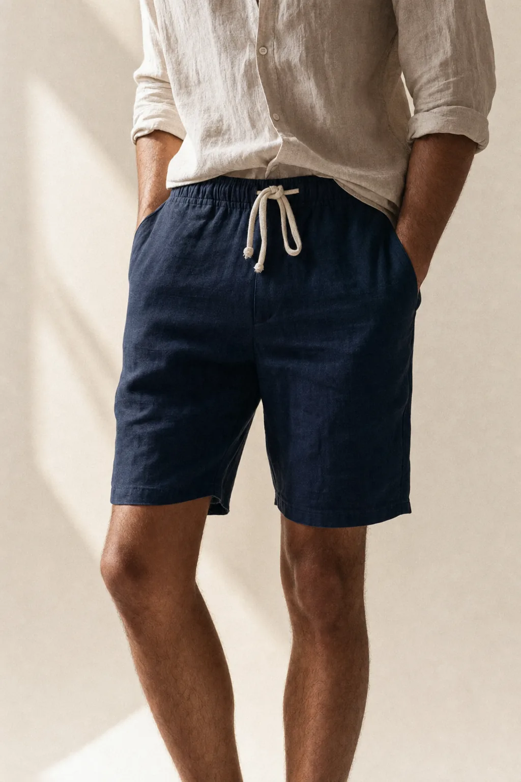 The Drawstring Linen Short in Deep Navy, on a man